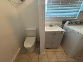 a bathroom with a toilet and a sink