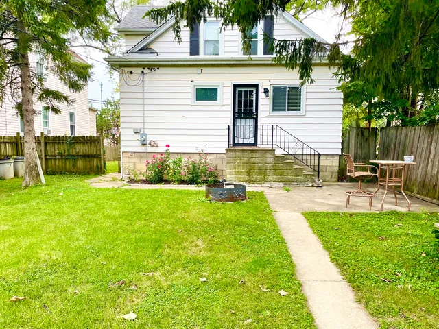 a view of backyard with a garden and plants
