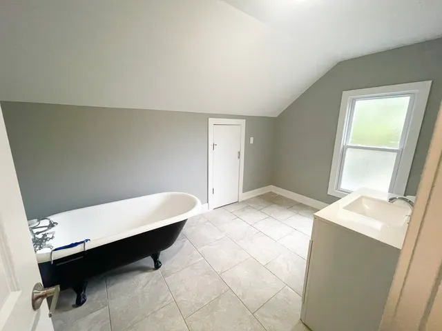 a room with a bed and a table