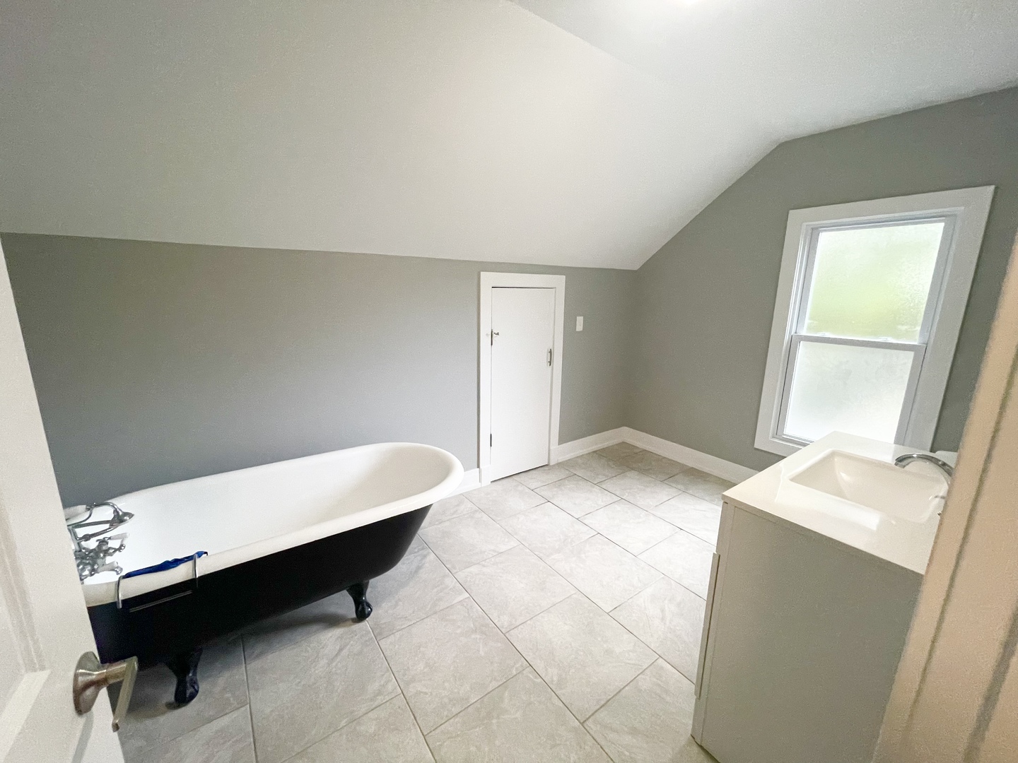 604 Clement Street Joliet, IL 60435 - Photo 9 of 14 a room with a bed and a table