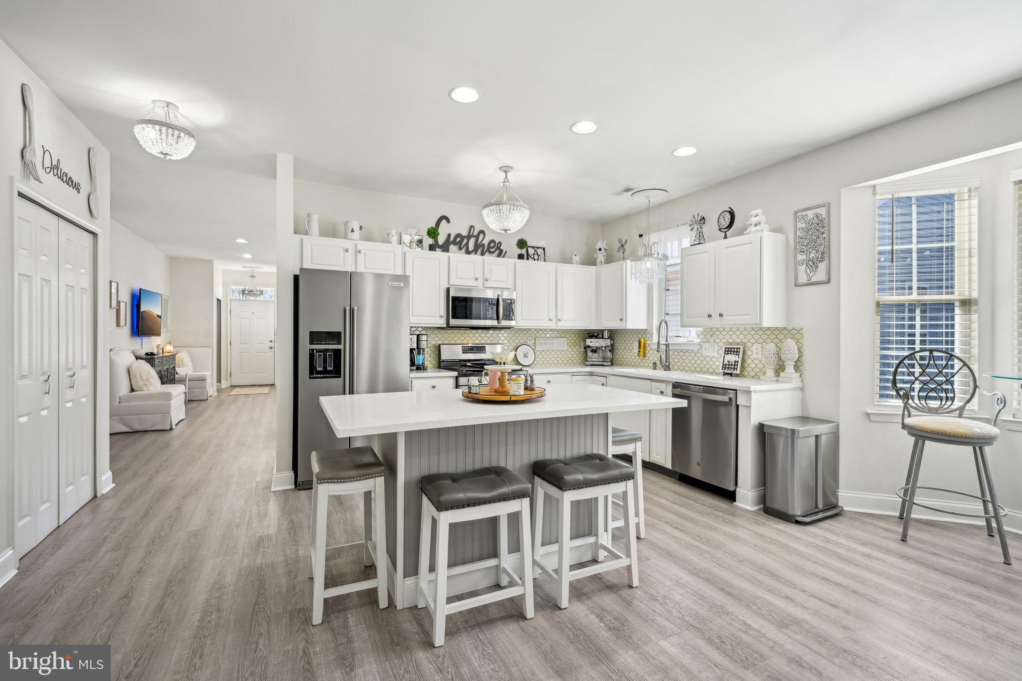 13 Carriage Berlin, NJ 08009 - Photo 16 of 41 a kitchen with white cabinets and stainless steel appliances