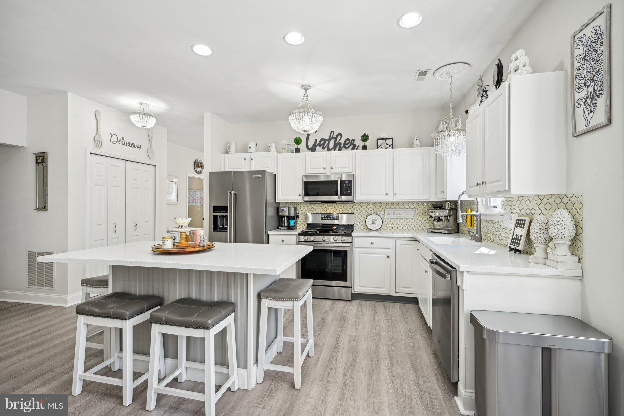 13 Carriage Berlin, NJ 08009 - Photo 17 of 41 a kitchen with white cabinets and stainless steel appliances