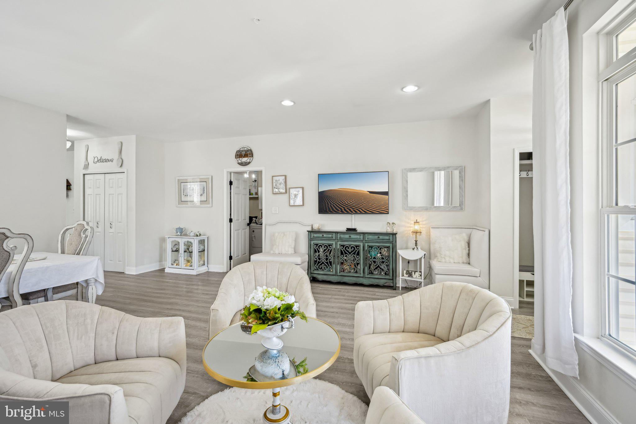 13 Carriage Berlin, NJ 08009 - Photo 23 of 41 a living room with furniture flat screen tv and a fireplace
