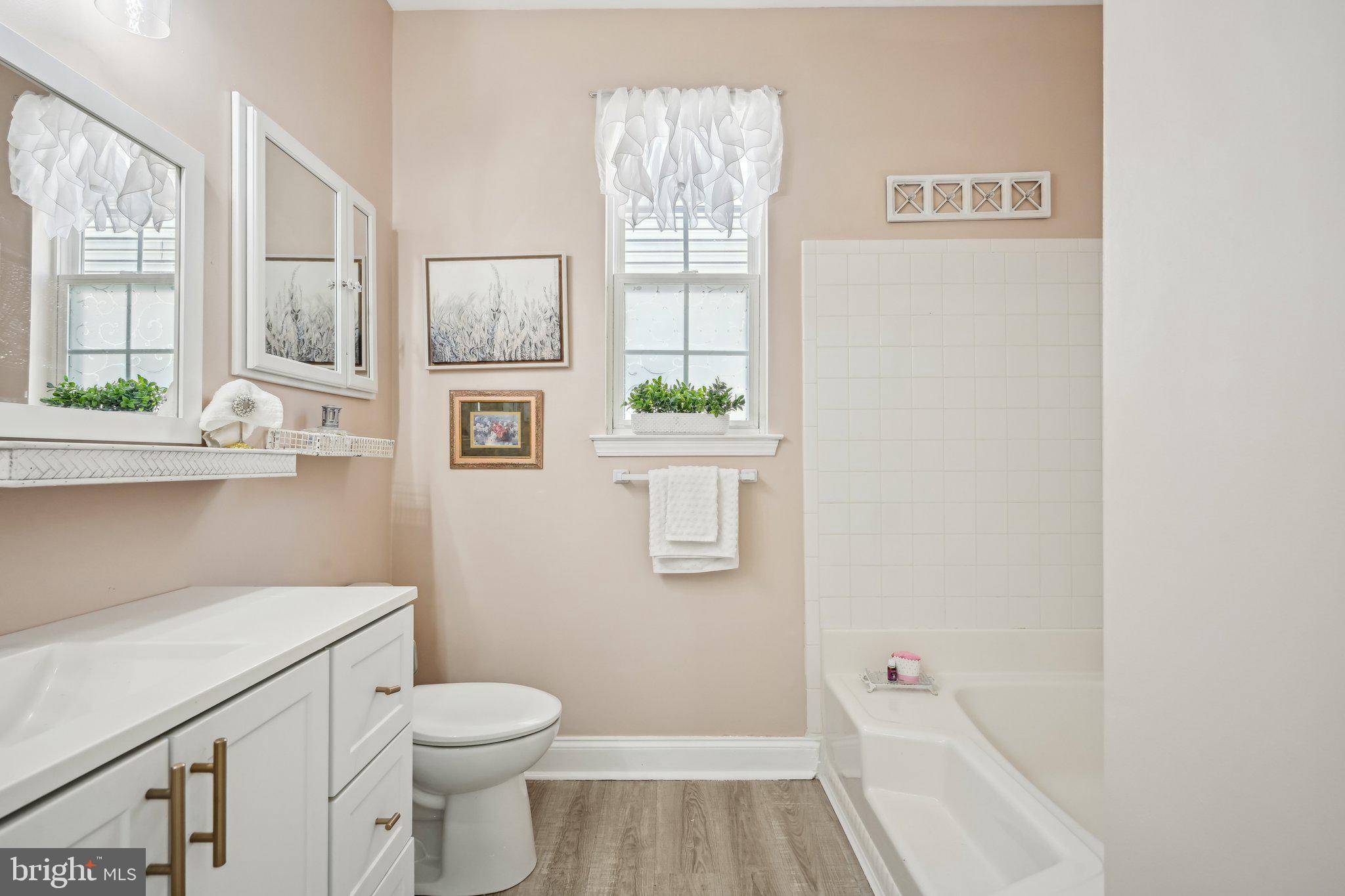 13 Carriage Berlin, NJ 08009 - Photo 25 of 41 a bathroom with a toilet and a shower curtain