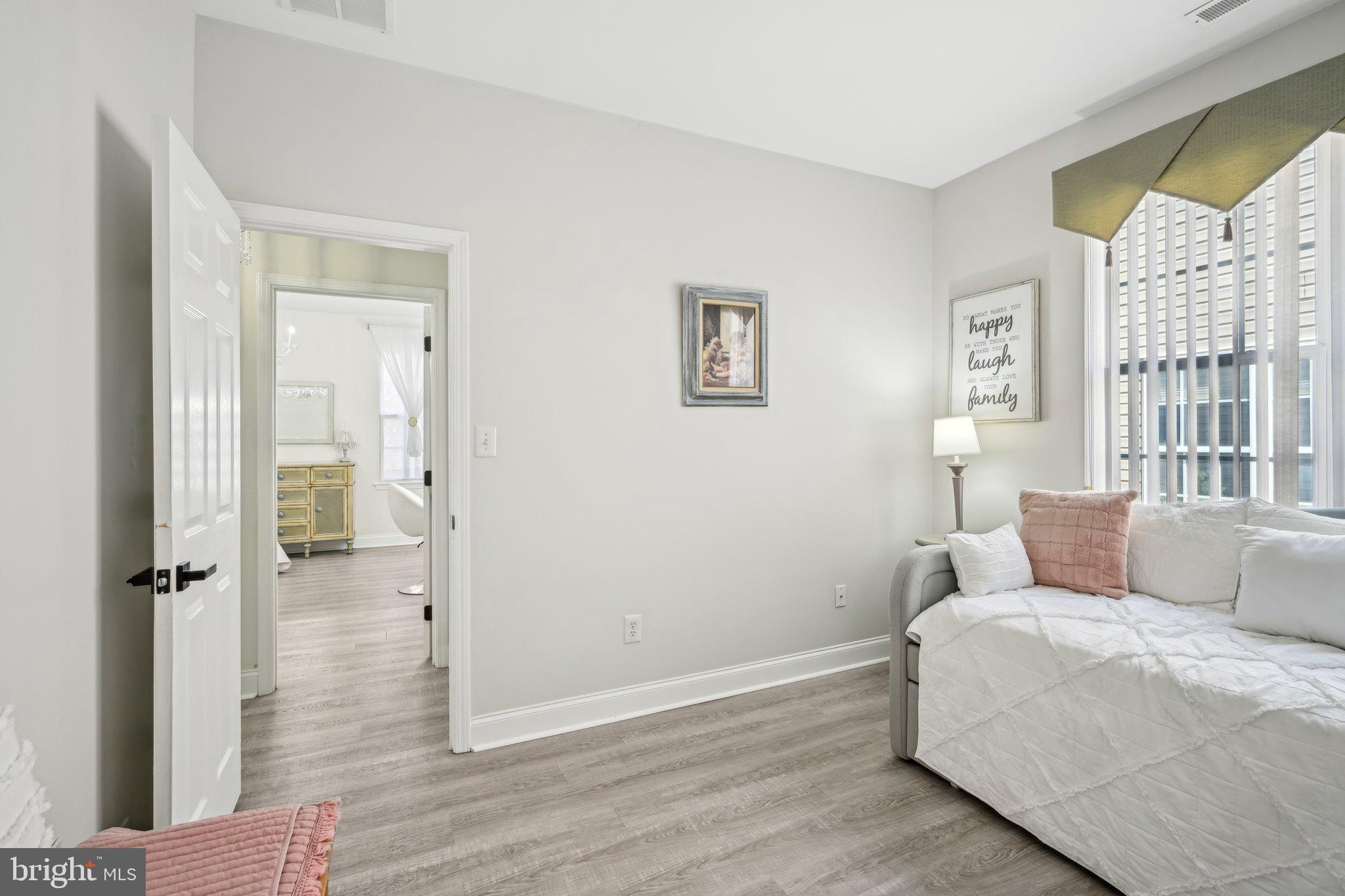 13 Carriage Berlin, NJ 08009 - Photo 29 of 41 a bedroom with a bed and wooden floor