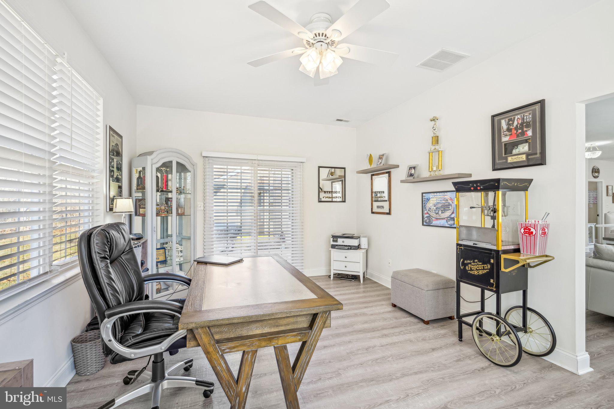 13 Carriage Berlin, NJ 08009 - Photo 30 of 41 a view of a workspace room with furniture wooden floor and chandelier