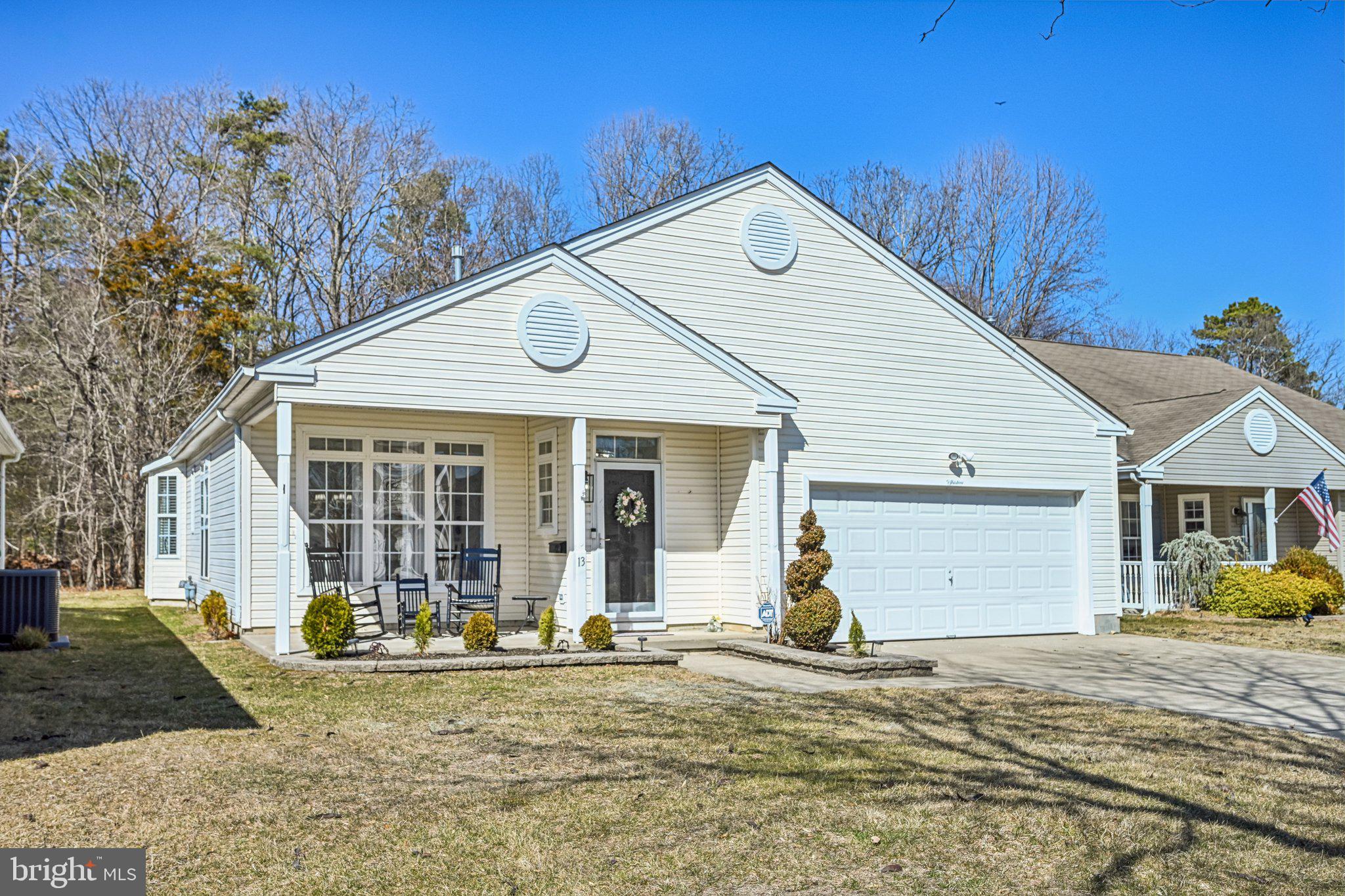 13 Carriage Berlin, NJ 08009 - Photo 3 of 41 a front view of a house with garden