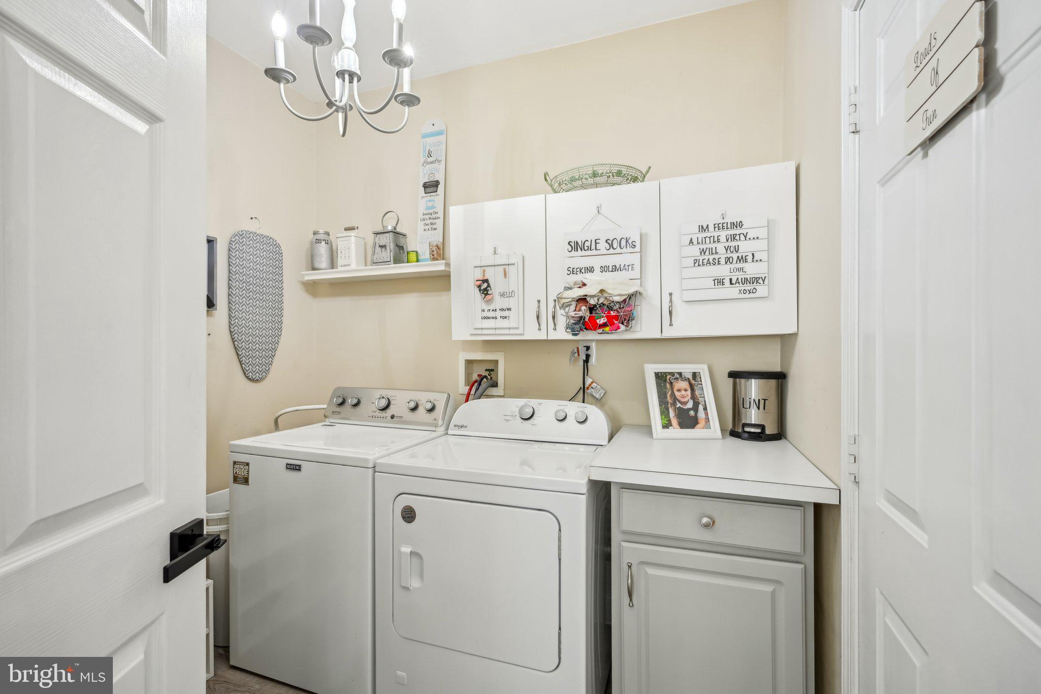 13 Carriage Berlin, NJ 08009 - Photo 32 of 41 a utility room with dryer washer and a view of kitchen