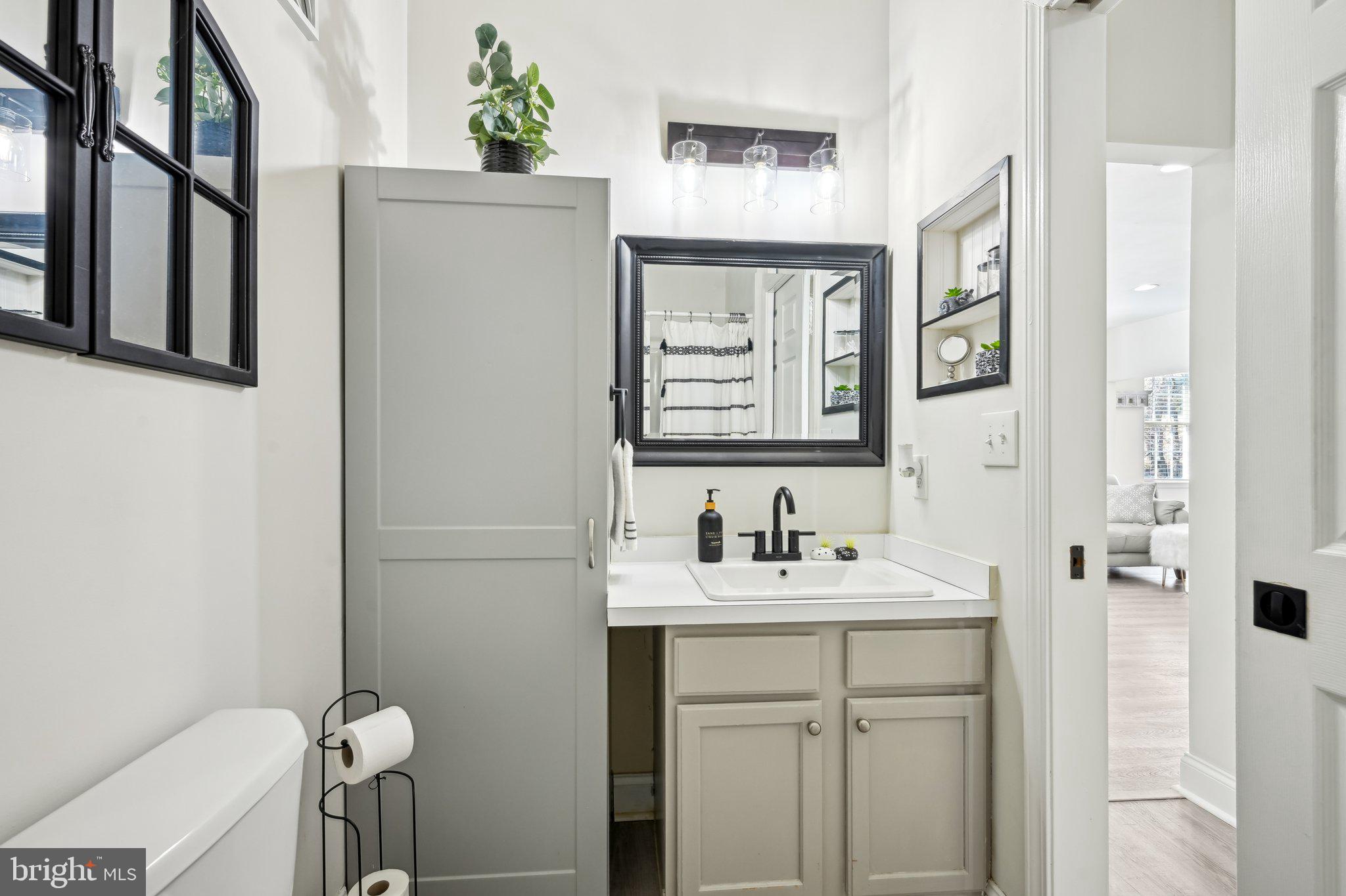 13 Carriage Berlin, NJ 08009 - Photo 34 of 41 a bathroom with a sink toilet and mirror