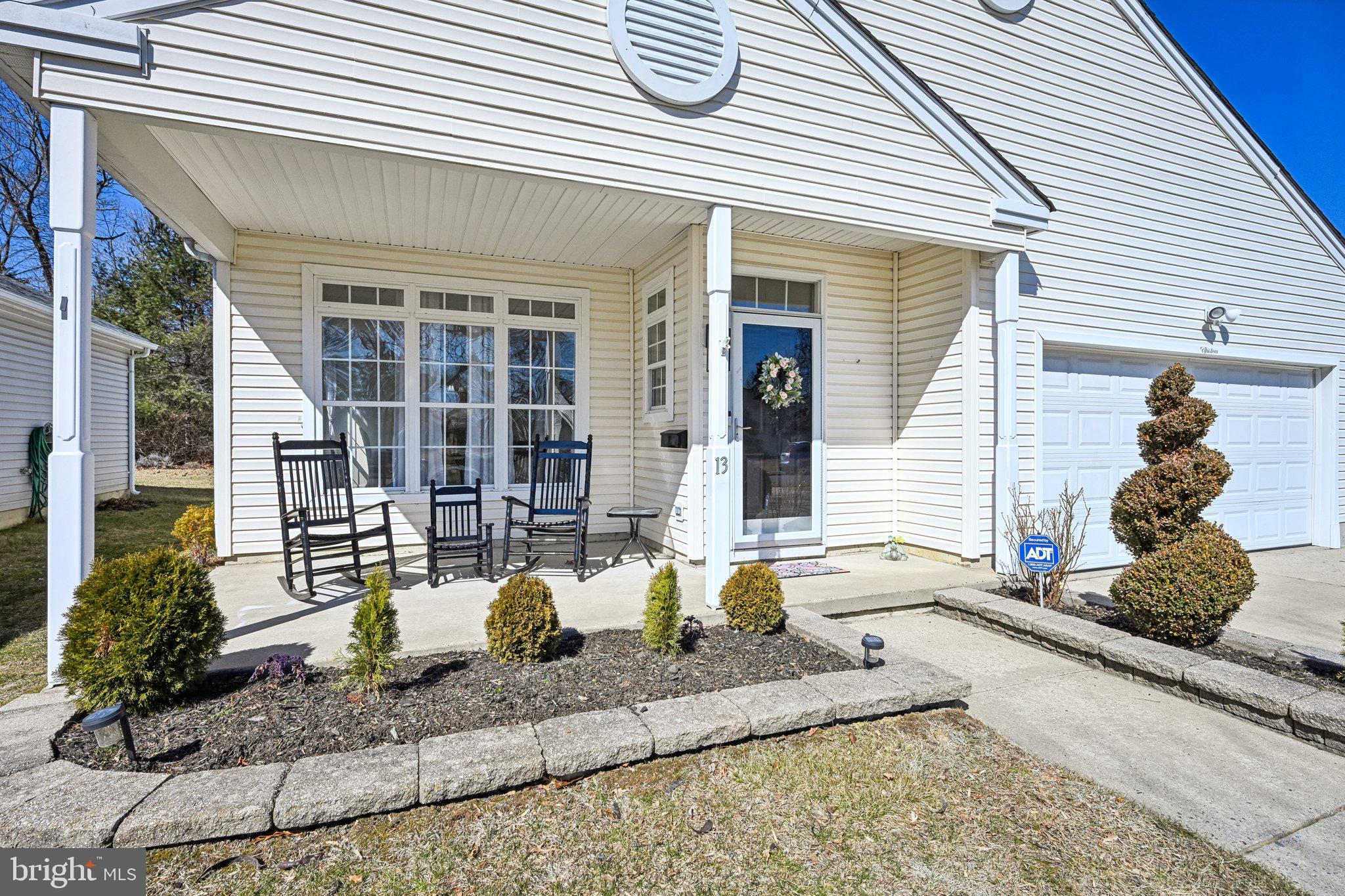 13 Carriage Berlin, NJ 08009 - Photo 4 of 41 a front view of a house with a sitting area