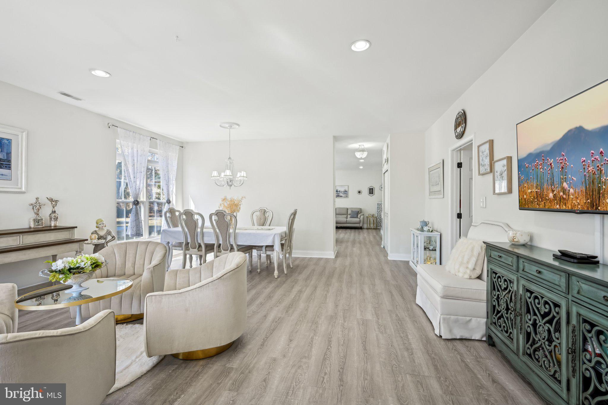 13 Carriage Berlin, NJ 08009 - Photo 7 of 41 a living room with furniture and a wooden floor