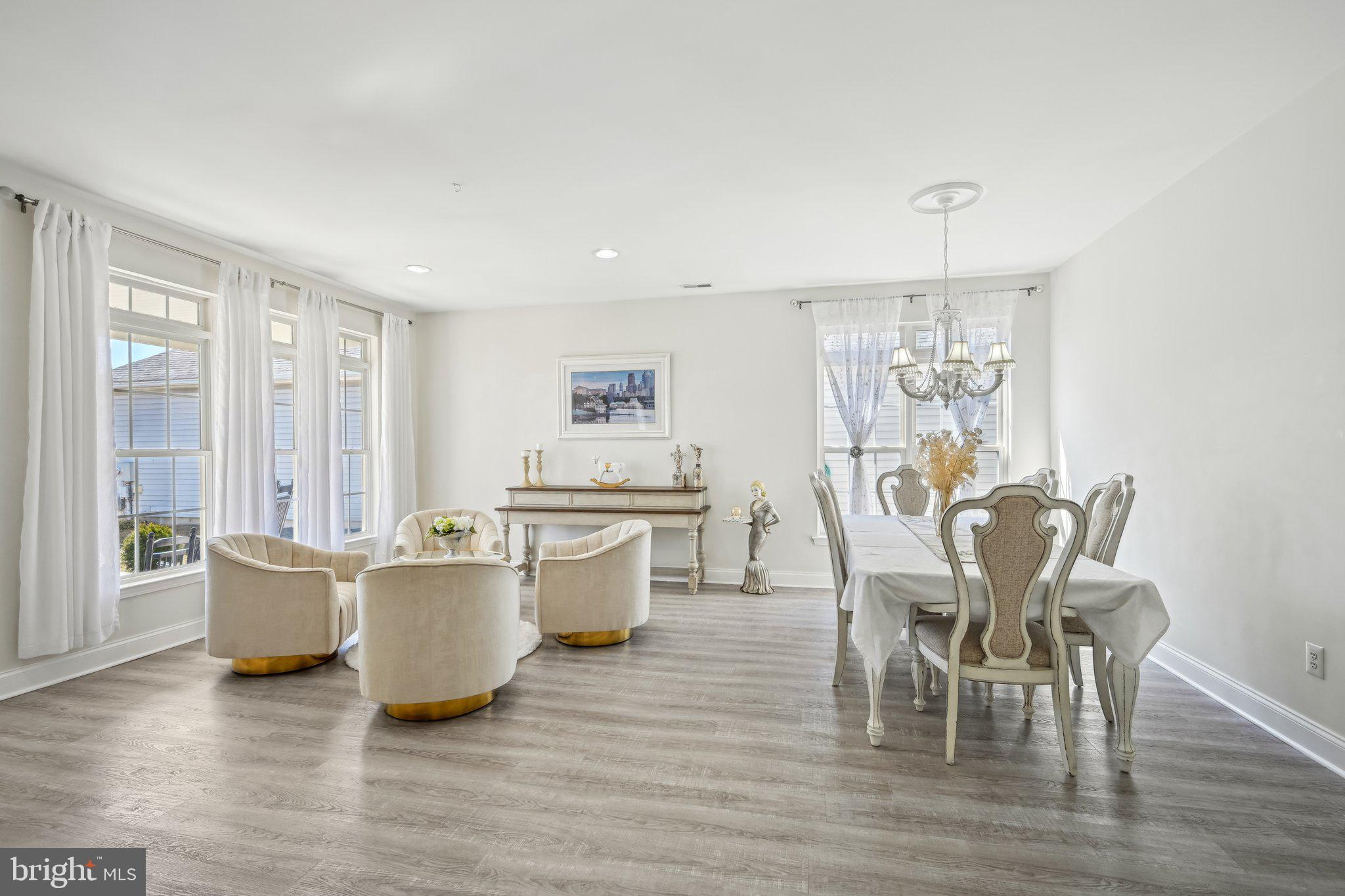 13 Carriage Berlin, NJ 08009 - Photo 9 of 41 a view of a dining room with furniture and wooden floor