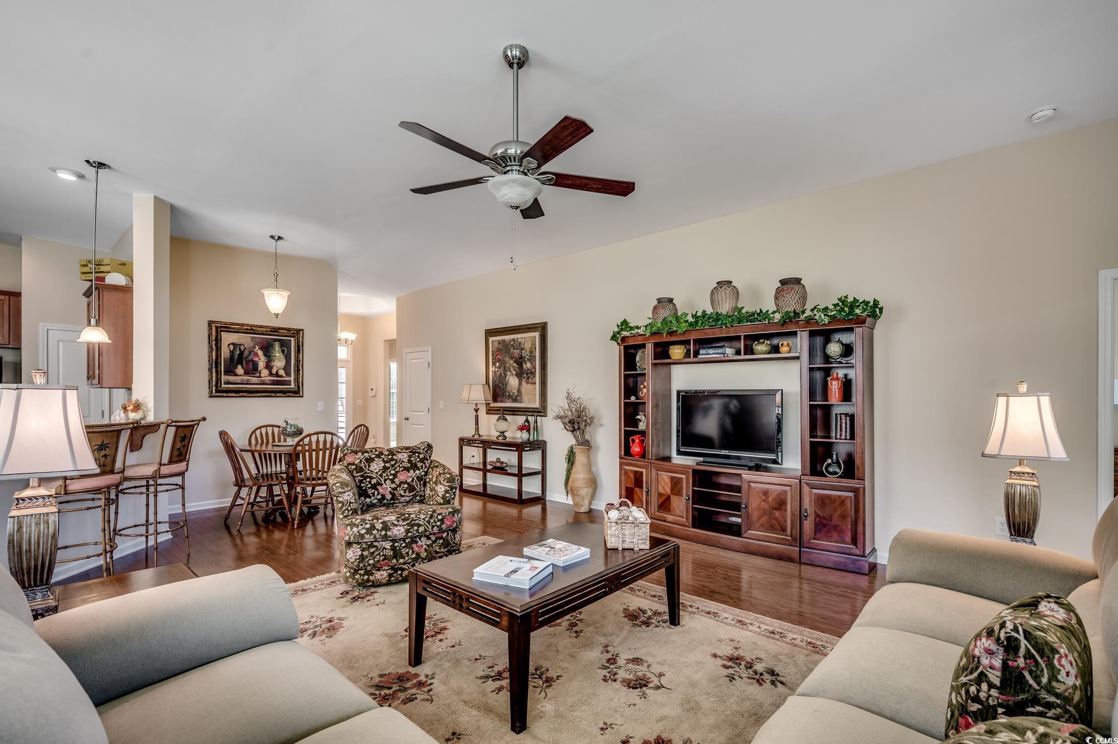 202 Fox Den Drive Murrells Inlet, SC 29576 - Photo 11 of 35 Living area featuring wood finished floors and a ceiling fan