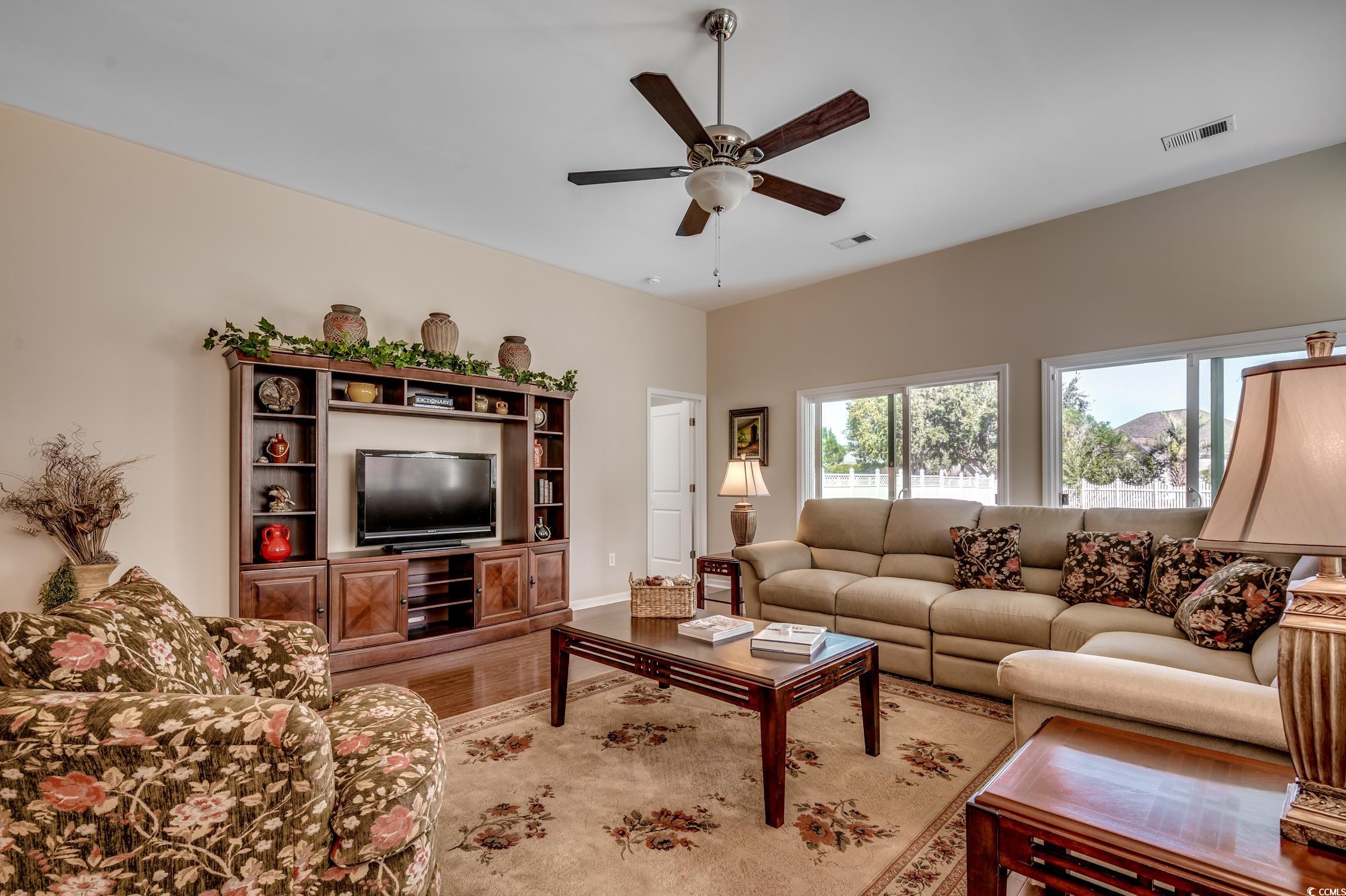 202 Fox Den Drive Murrells Inlet, SC 29576 - Photo 12 of 35 Living room featuring wood finished floors and a ceiling fan