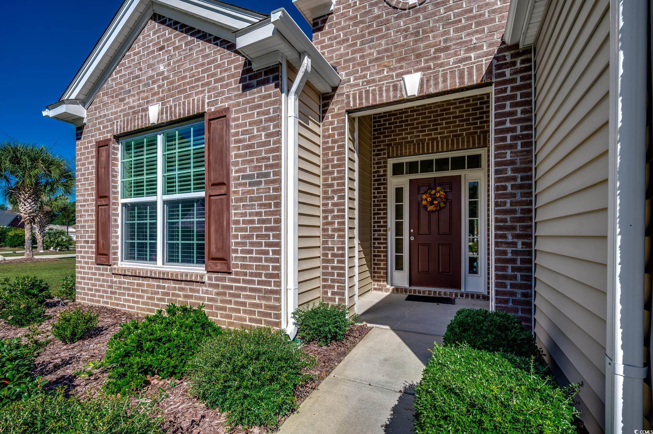 202 Fox Den Drive Murrells Inlet, SC 29576 - Photo 5 of 35 Property entrance featuring brick siding