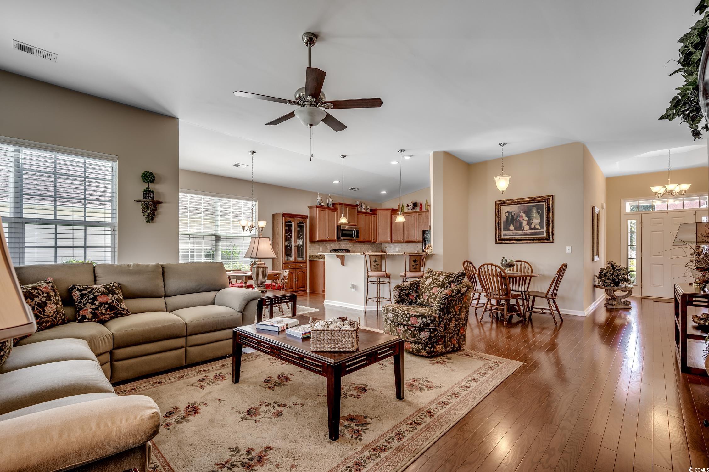 202 Fox Den Drive Murrells Inlet, SC 29576 - Photo 10 of 35 Living area with a chandelier, light wood finished floors, ceiling fan, and recessed lighting