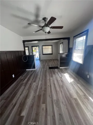 a view of granite countertop white cabinets and a sink