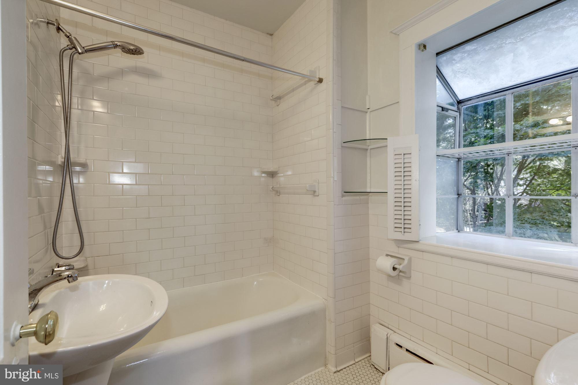 1533 Foxhall Road Northwest Washington, DC 20007 - Photo 19 of 22 tiled tub/bath combo