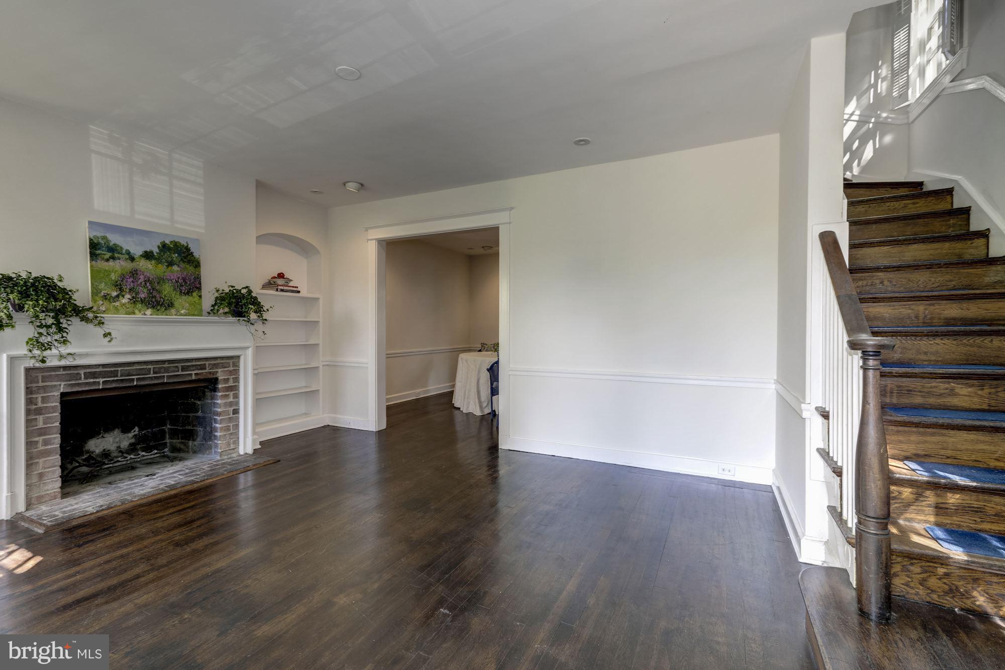 1533 Foxhall Road Northwest Washington, DC 20007 - Photo 5 of 22 Living room with fireplace and beautiful molding