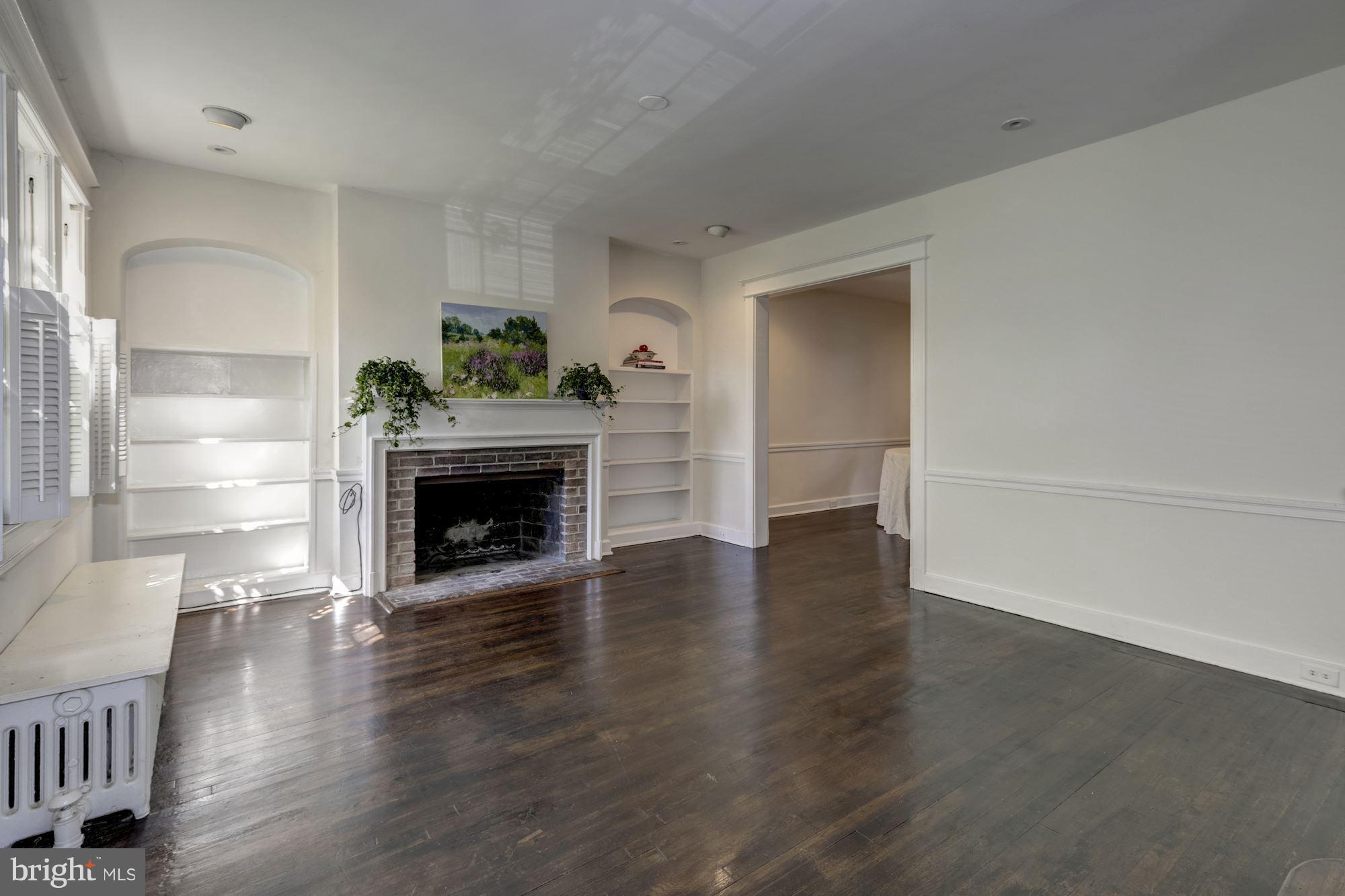1533 Foxhall Road Northwest Washington, DC 20007 - Photo 9 of 22 Living room with built-in book cases
