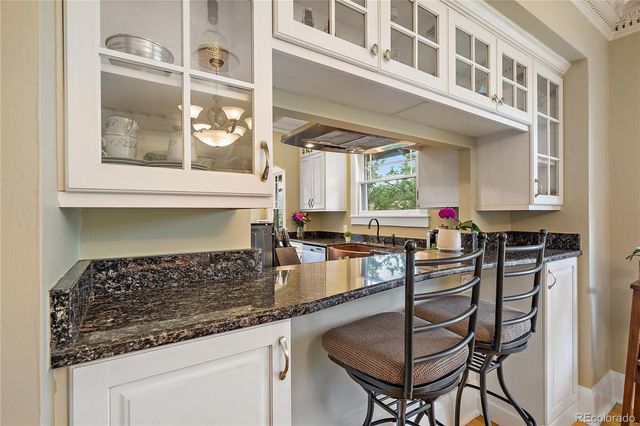 a kitchen with stainless steel appliances a stove a sink and a refrigerator