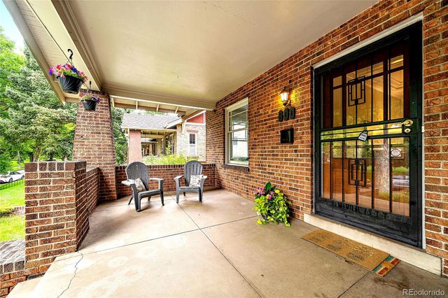 a glass door with yard and balcony