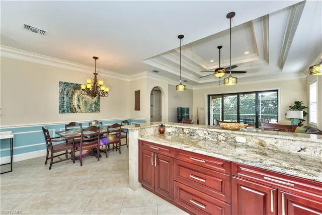 a large kitchen with a table and chairs