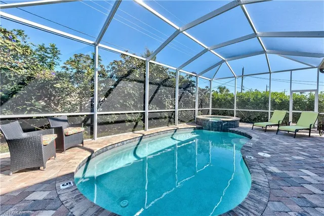 a view of a swimming pool with a patio