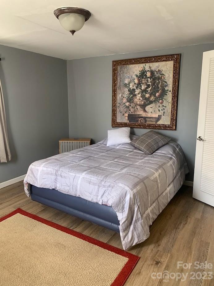 177 McDaniel Road Blacksburg, SC 29702 - Photo 7 of 16 a bedroom with a large bed and a large window