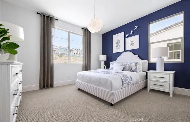 a bedroom with a bed and a night stand