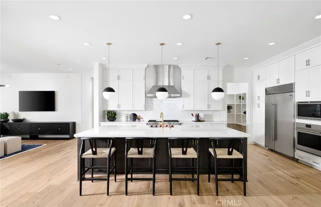 a front view of a house with swimming pool and sitting space