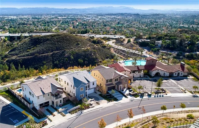a view of house with a swimming pool