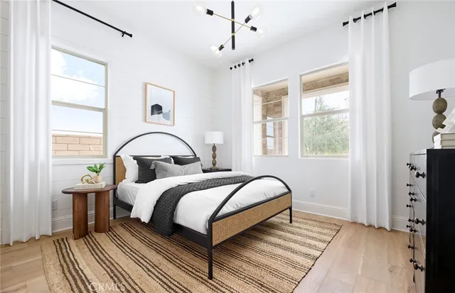 a bedroom with bed and window