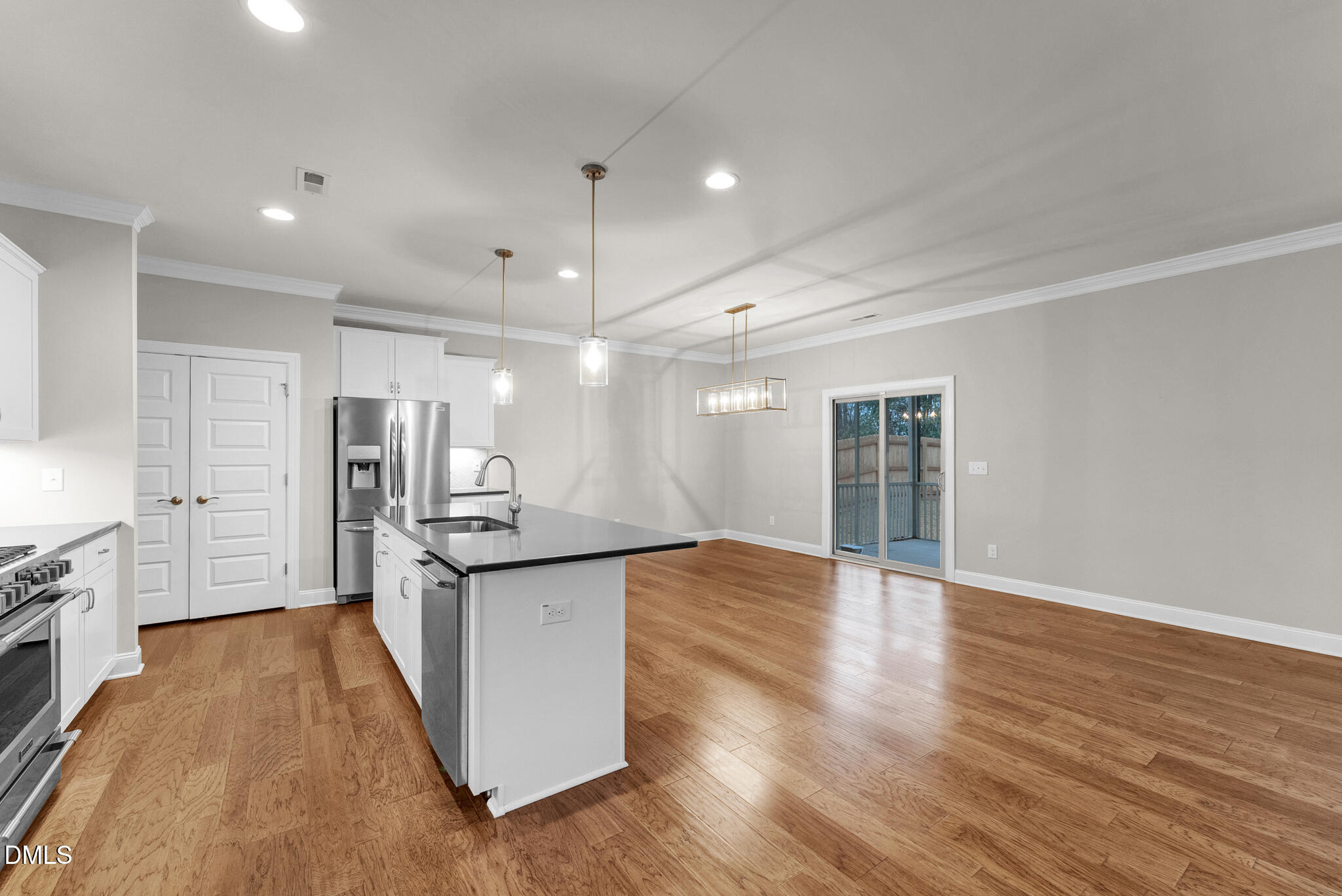 928 Barringer Drive Raleigh, NC 27606 - Photo 11 of 40 a kitchen with stainless steel appliances granite countertop a sink and cabinets