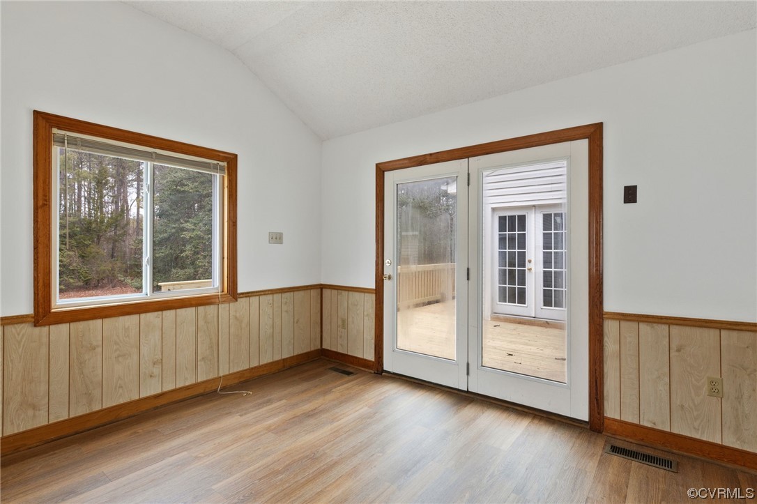 9106 Hickory Road Chesterfield, VA 23838 - Photo 14 of 42 a view of an empty room with wooden floor and windows