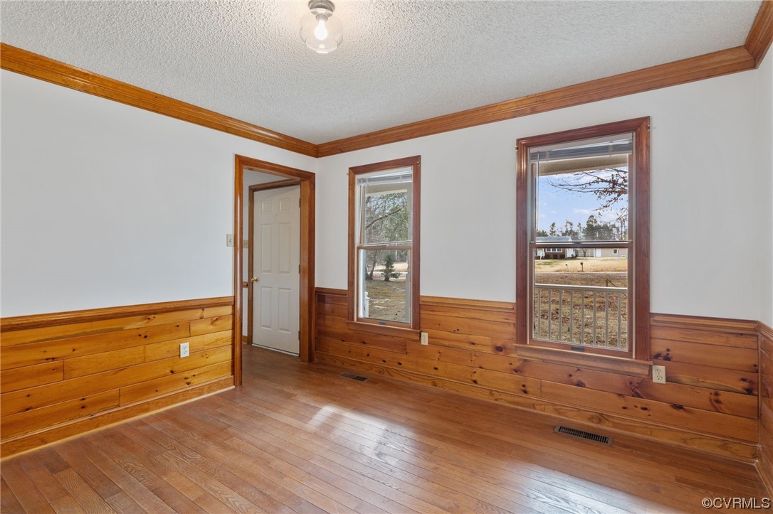 9106 Hickory Road Chesterfield, VA 23838 - Photo 8 of 42 a view of an empty room with wooden floor and a window