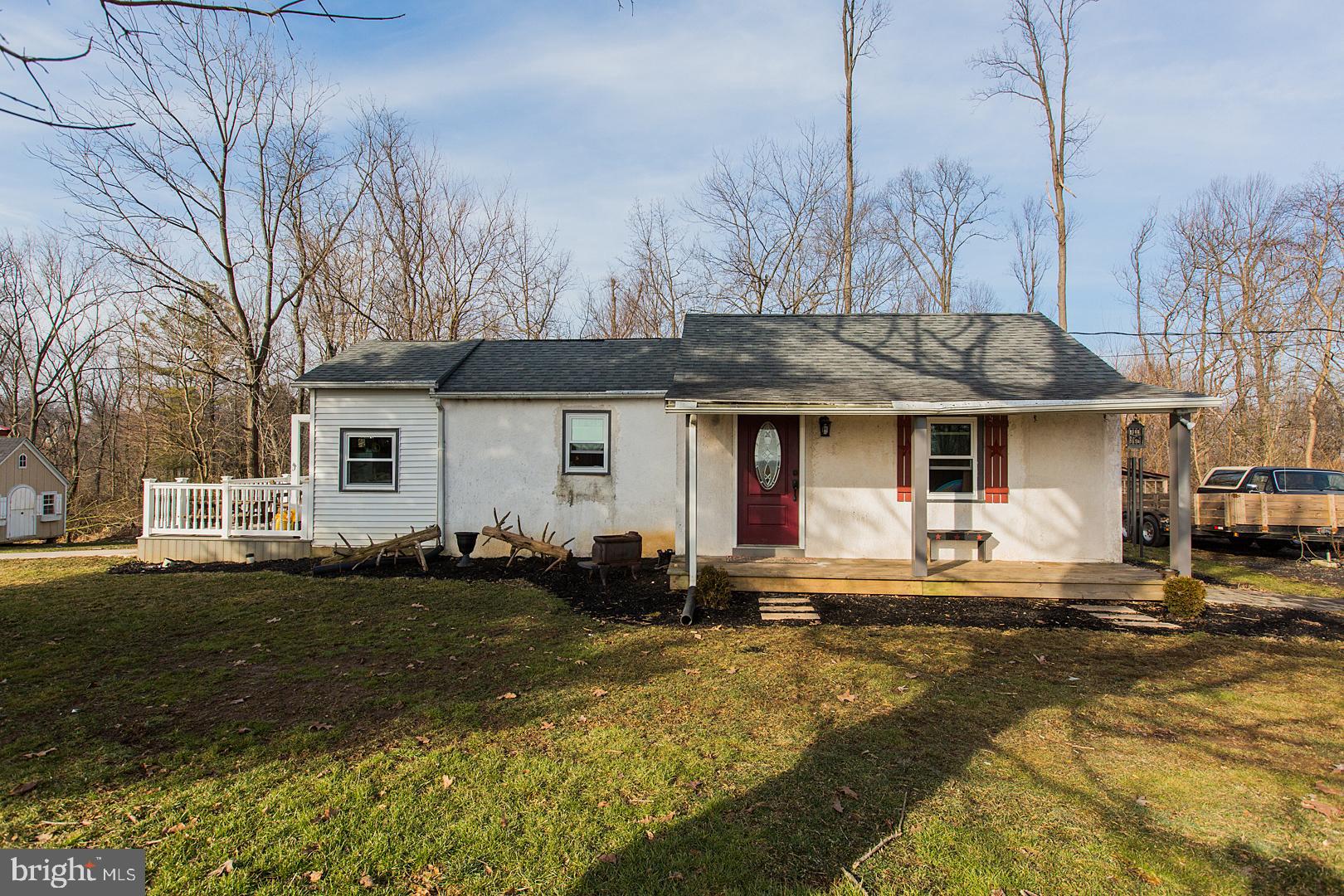 38 Fulton View Road Quarryville, PA 17566 - Photo 1 of 42 a front view of a house with a yard patio and fire pit