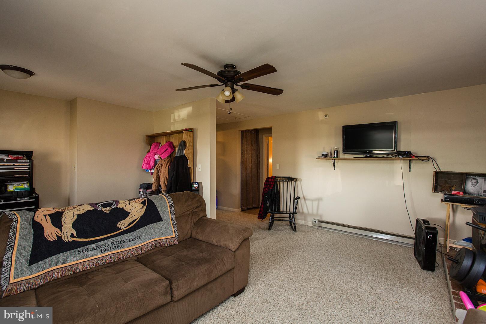 38 Fulton View Road Quarryville, PA 17566 - Photo 12 of 42 a living room with furniture and a flat screen tv