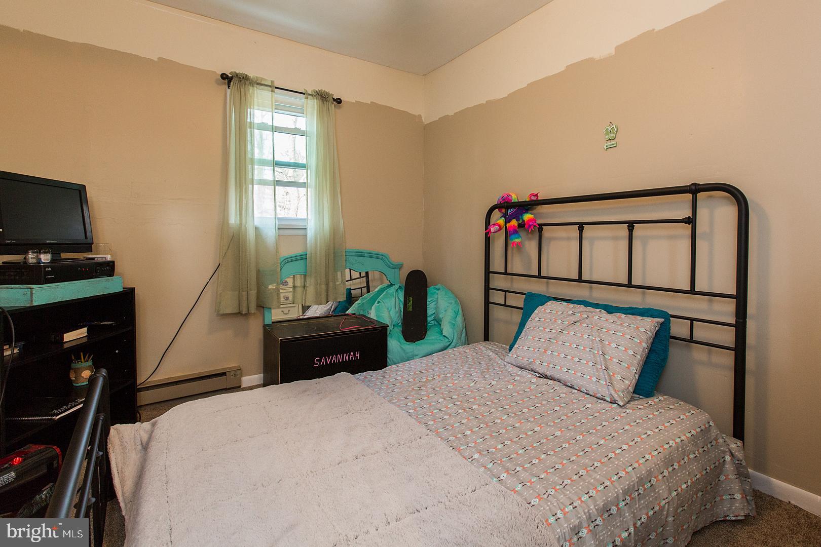 38 Fulton View Road Quarryville, PA 17566 - Photo 18 of 42 a bedroom with a bed and a flat tv screen on the dresser