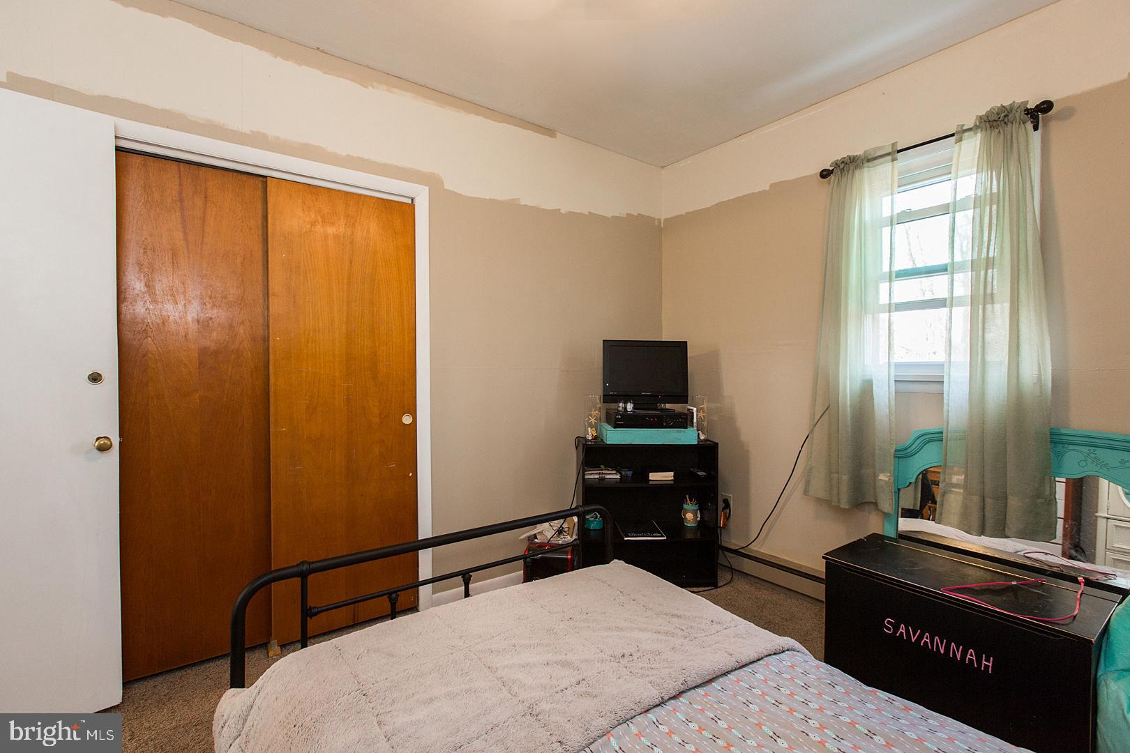 38 Fulton View Road Quarryville, PA 17566 - Photo 19 of 42 a bedroom with a bed and wooden floor