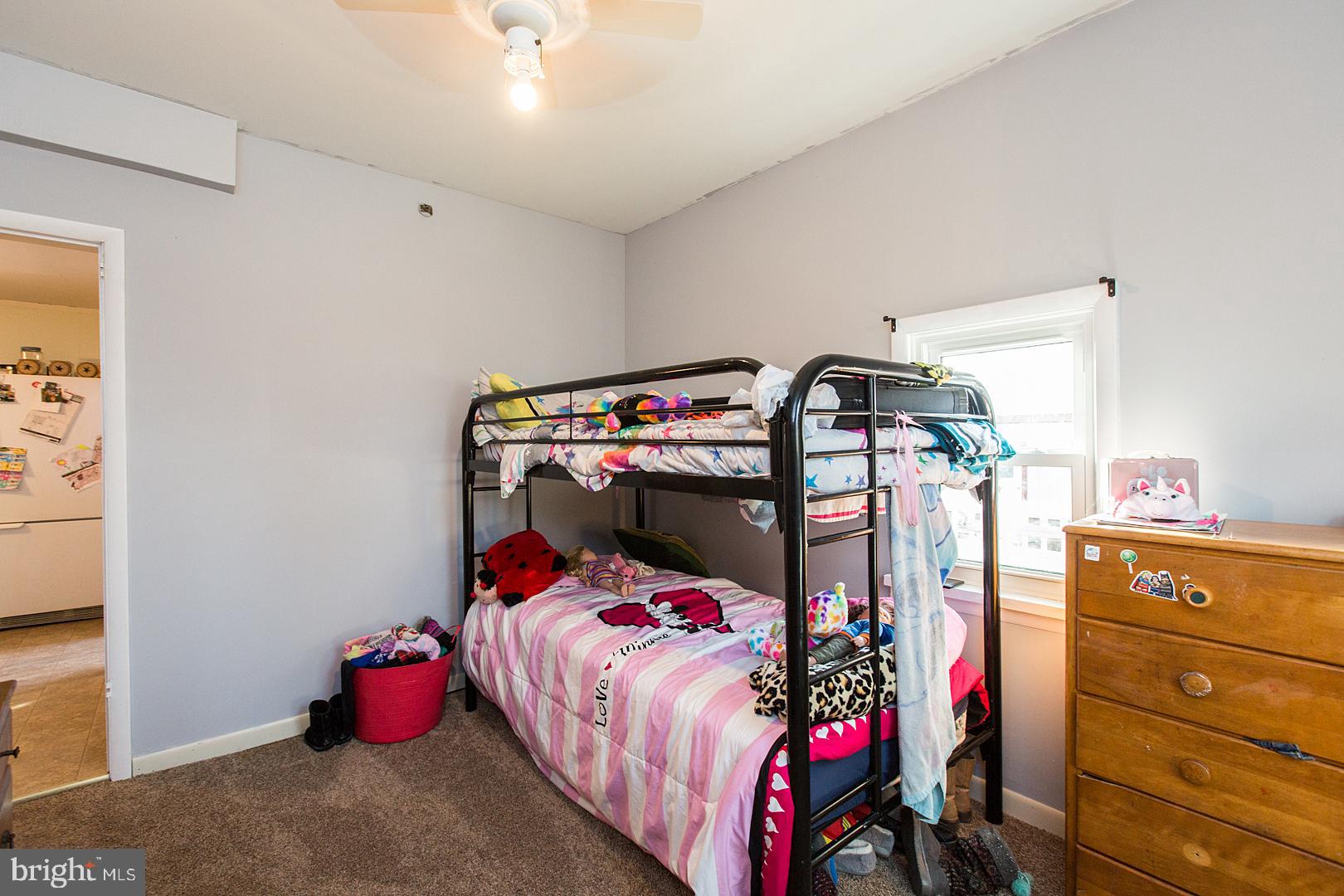 38 Fulton View Road Quarryville, PA 17566 - Photo 21 of 42 a bedroom with a bed and a chandelier