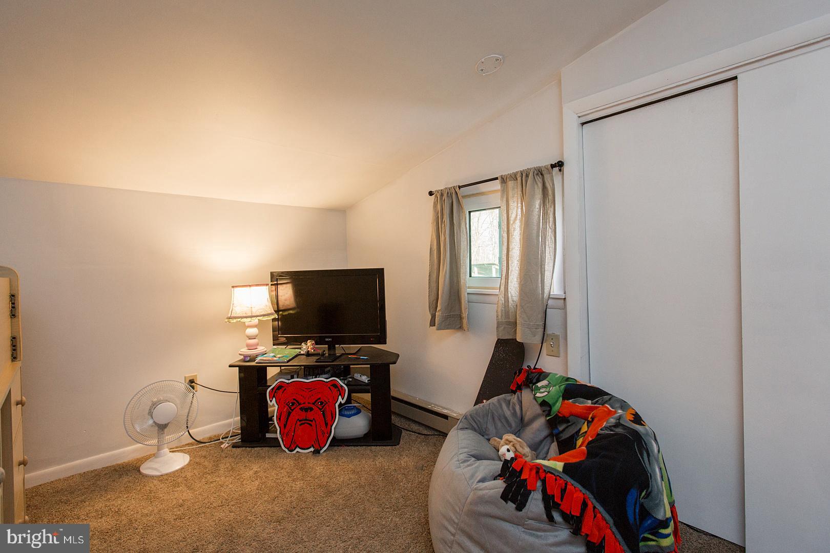 38 Fulton View Road Quarryville, PA 17566 - Photo 23 of 42 a bedroom with a bed and a flat tv screen on the dresser