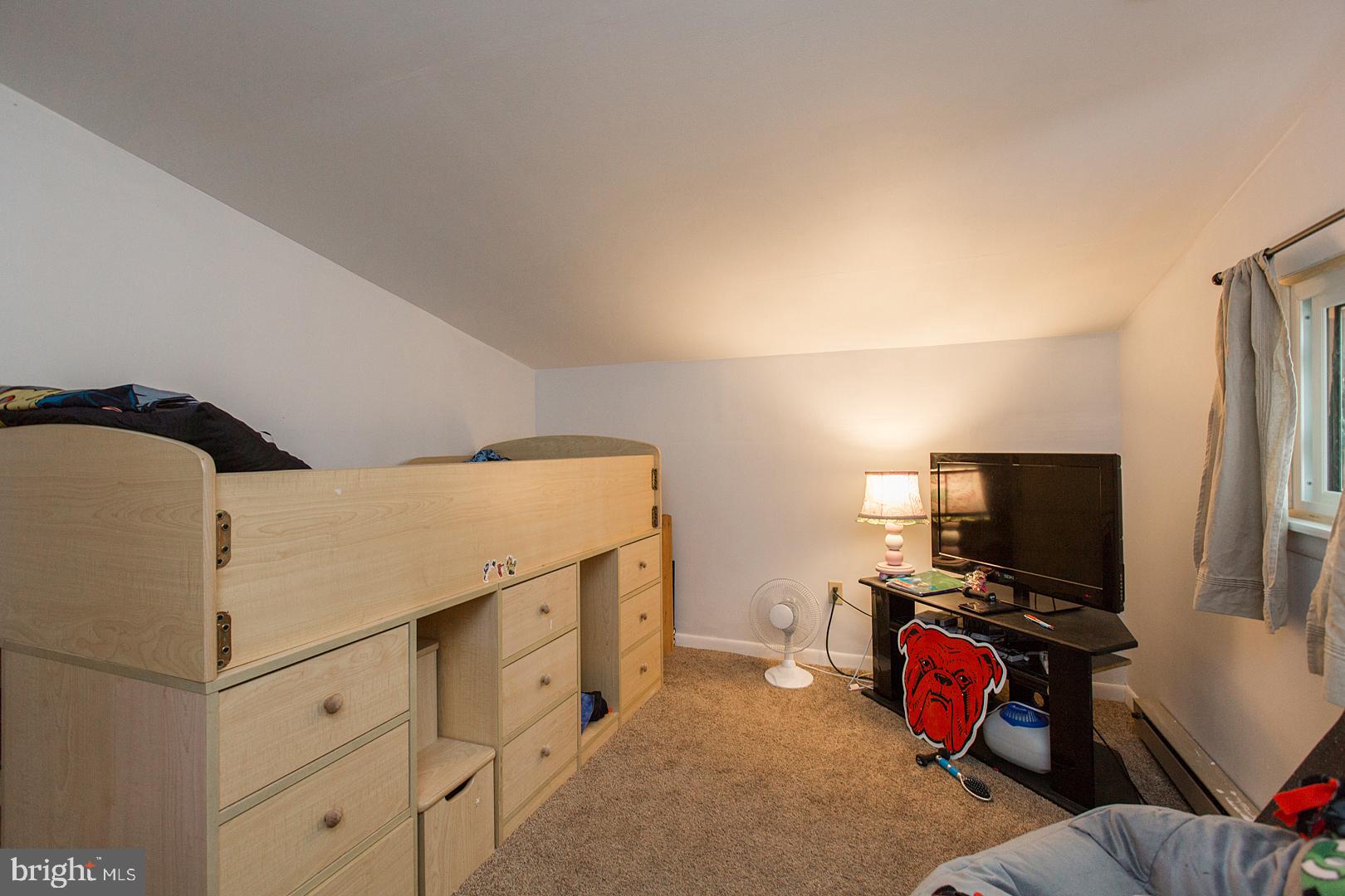 38 Fulton View Road Quarryville, PA 17566 - Photo 24 of 42 a bedroom with a bed and a flat screen tv