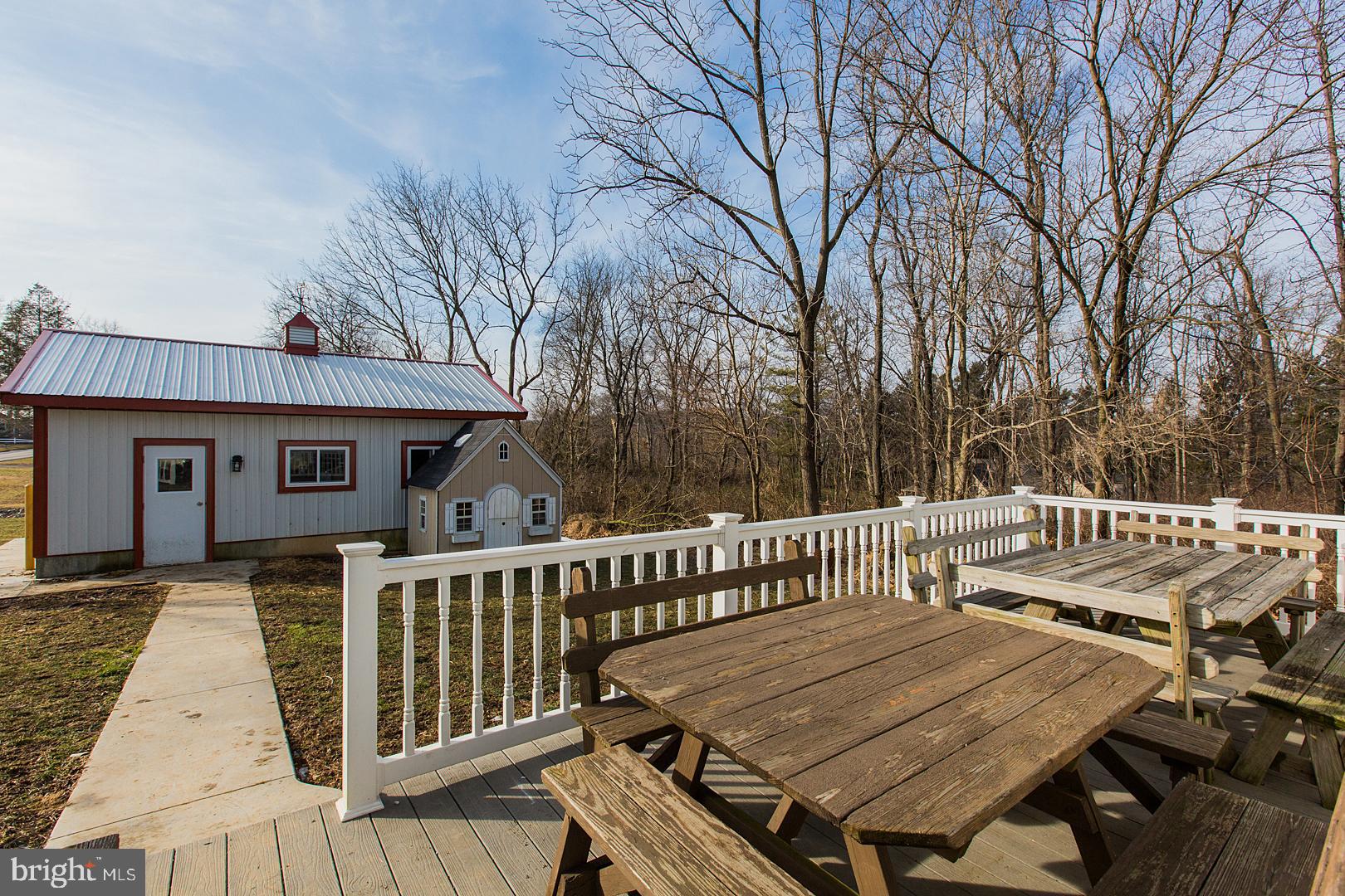 38 Fulton View Road Quarryville, PA 17566 - Photo 28 of 42 a view of a wooden deck with furniture and trees