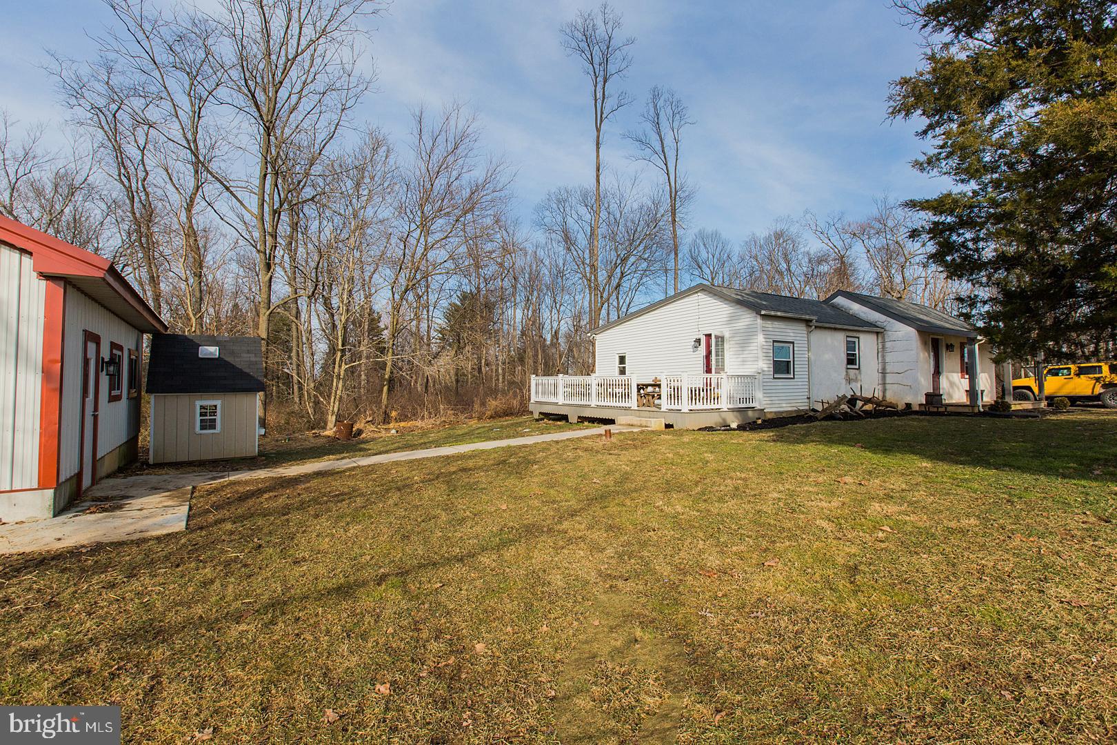 38 Fulton View Road Quarryville, PA 17566 - Photo 31 of 42 a view of a white house with a large tree and wooden fence