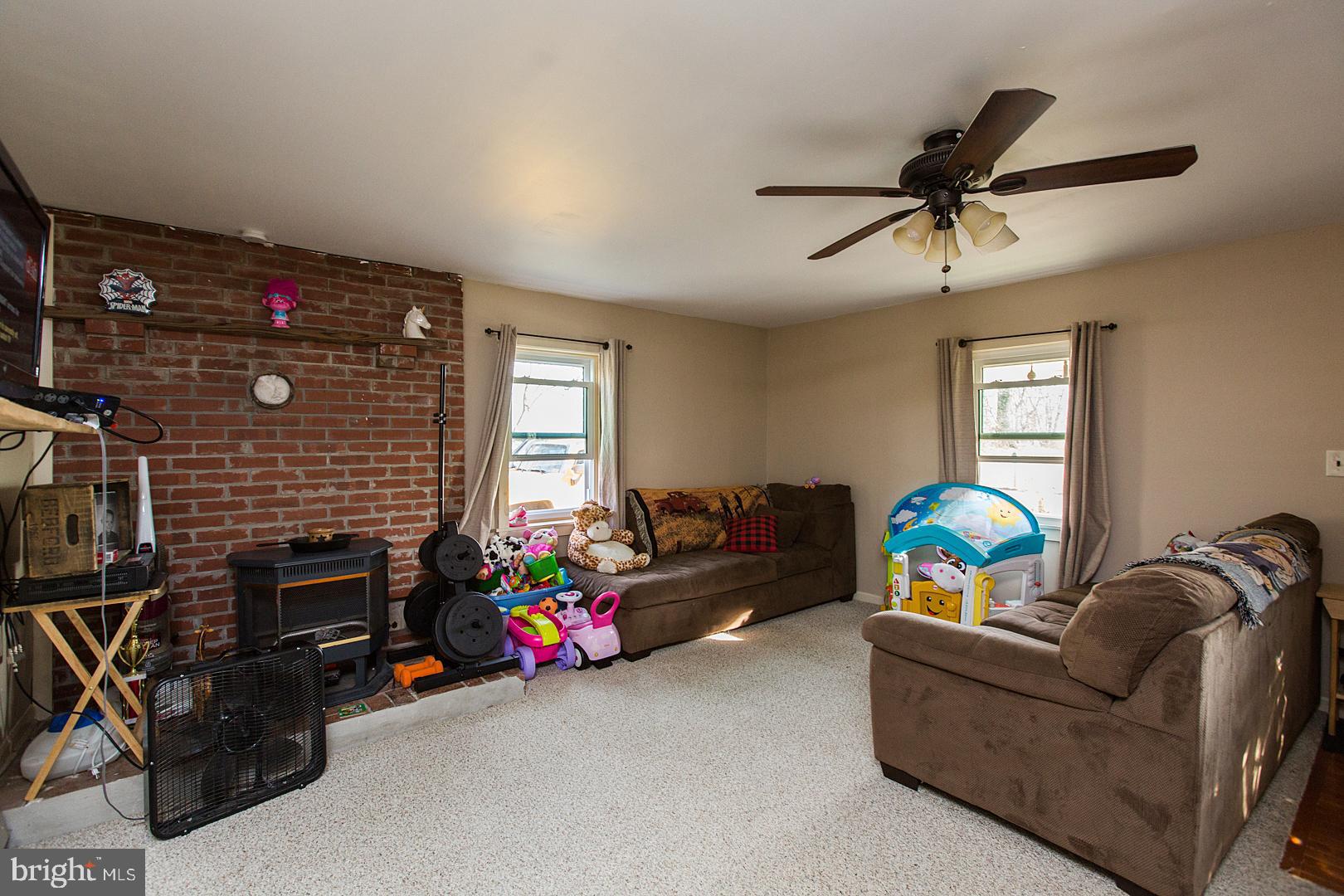 38 Fulton View Road Quarryville, PA 17566 - Photo 10 of 42 a living room with furniture and a fireplace