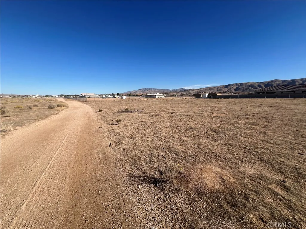 0 Panoche Road Apple Valley, CA 92308 - Photo 3 of 8 a view of an ocean beach and mountain