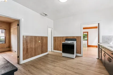 a view of a kitchen with an entryway and a stove