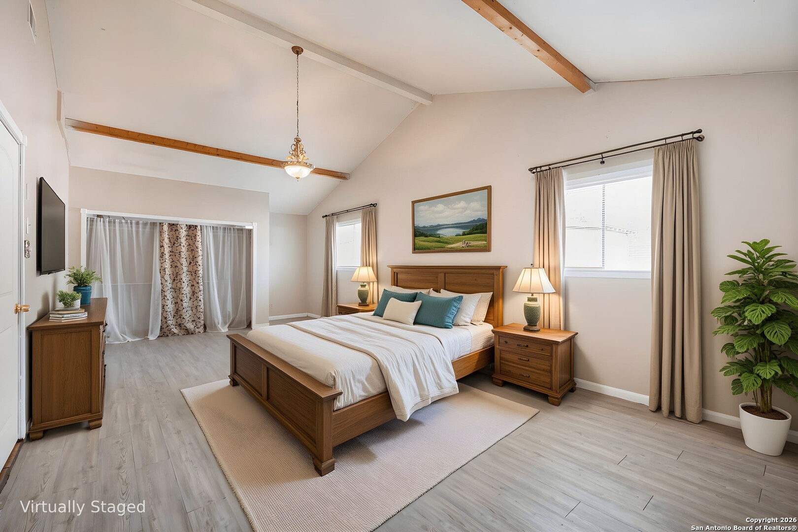 5207 Overpool Street San Antonio, TX 78228 - Photo 12 of 31 a spacious bedroom with a large bed and a potted plant