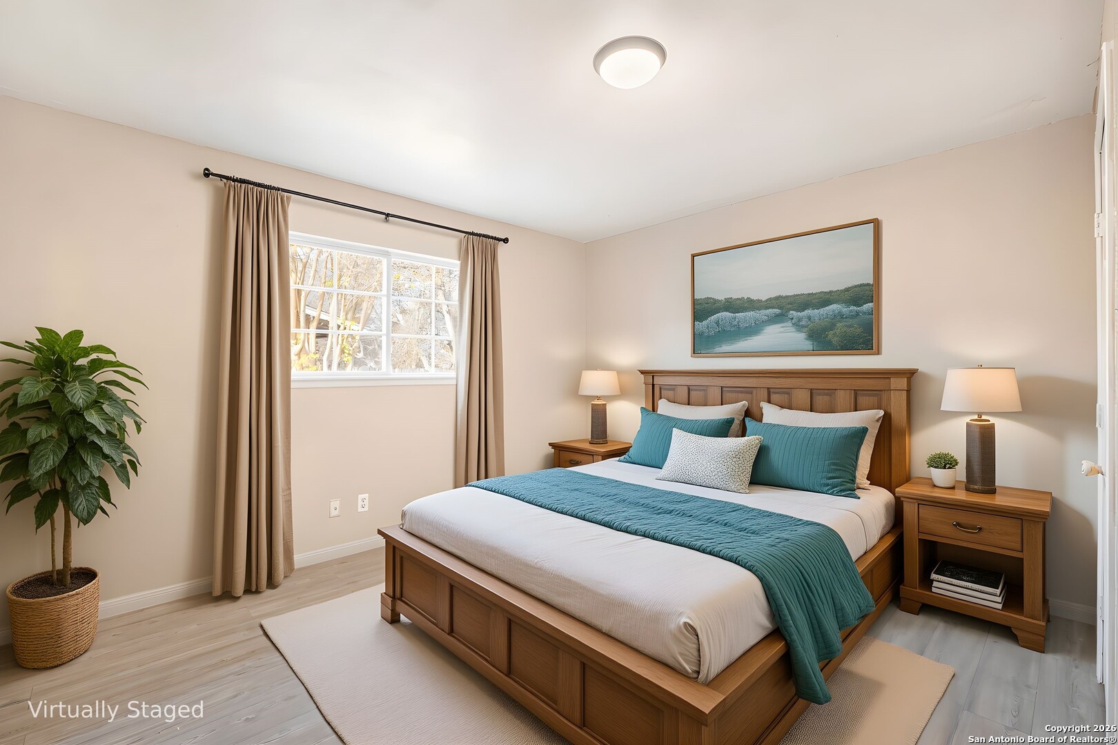 5207 Overpool Street San Antonio, TX 78228 - Photo 14 of 31 a bedroom with bed and a potted plant